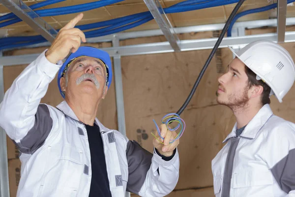Builders Checking Leak Problem Roof — Zdjęcie stockowe