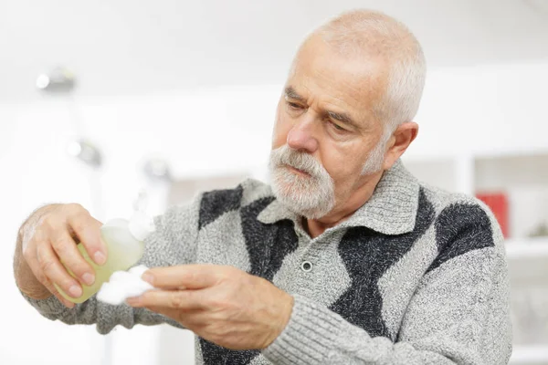 Senior Man Holding Peroxide Cotton Wool Glass Jar — Stock Photo, Image