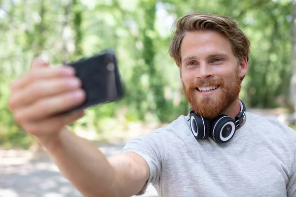 Man Sitting Makes Selfie Forest — Stock Photo, Image