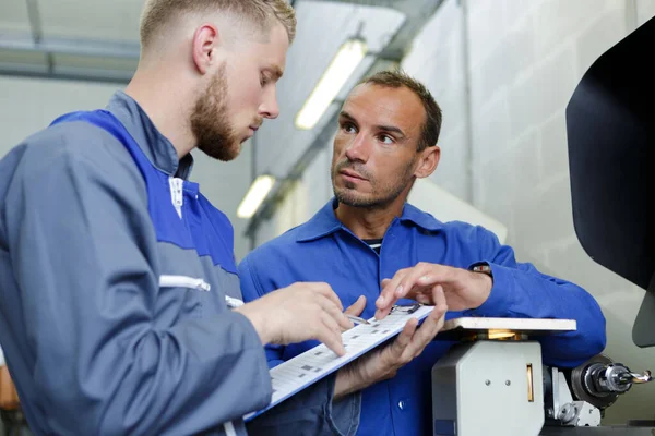 Two Specialist Repairmen Blue Overall Talking — Stock Photo, Image