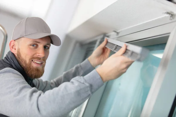Young Man Installing Window Blinds — Stock Photo, Image