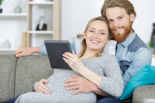 Attractive Happy Young Man Pregnant Woman Holding Digital Tablet — 图库照片