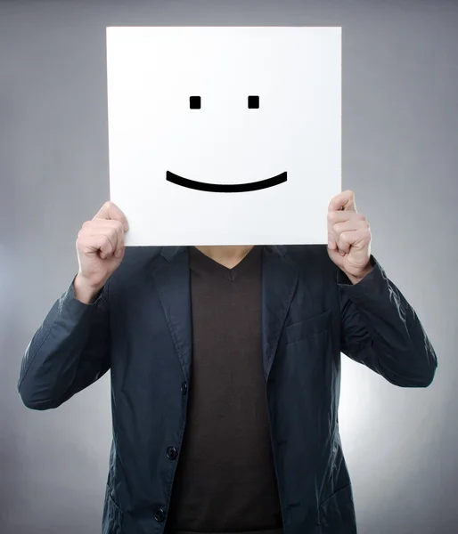 Mannen bakom smiley-symbol — Stockfoto