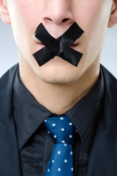 Man with black tape over his mouth — Stock Photo, Image