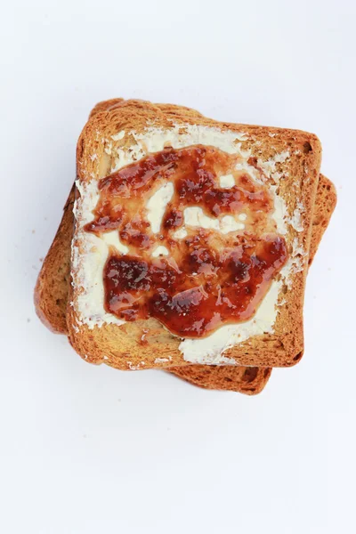 Butter and strawberry jam on toast — Stock Photo, Image