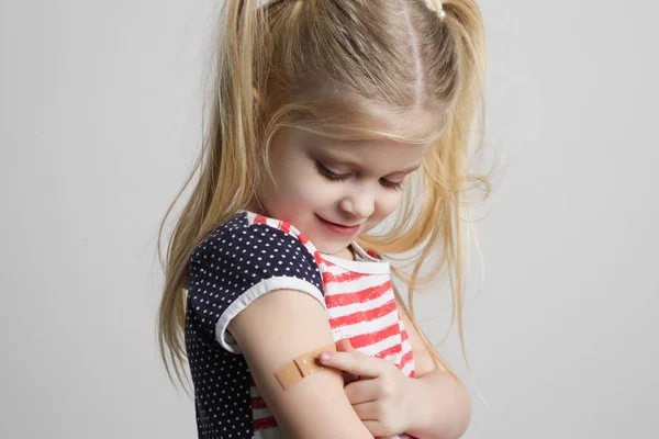 Child Vaccination Little Girl Showing Adhezive Arm Bandage Studio Shot — Stockfoto