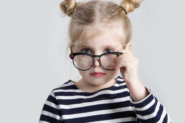 Portrait Cute Little Girl Adjusting Her Reading Glasses Looking Camera — Stockfoto