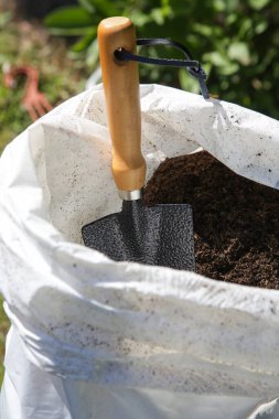 Garden shovel sack full of  soil