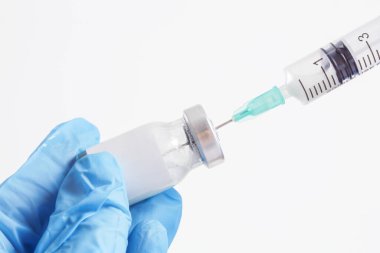 Scientist or medical worker holds vaccine bottle.Vaccination, immunization, treatment to provides active acquired immunity to a particular infectious disease. Healthcare And Medical concept.