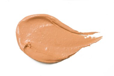 Beyaz arkaplanda lekeli turuncu ruj izole edilmiş.