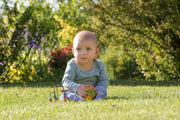 Portrait Cute Blue Eyed Baby Boy Flower Garden Playing Toys — Stock Photo, Image
