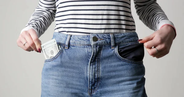 Woman Showing One Pocket Full Money While Another One Empty — Stock Photo, Image