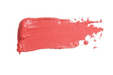 Beyaz arkaplanda lekeli turuncu ruj izole edilmiş.
