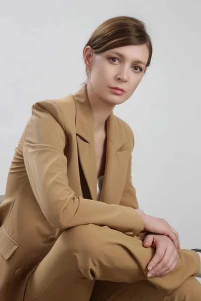 Female Model Wearing Beige Tailored Suit White Silk Top Studio — Stock Photo, Image