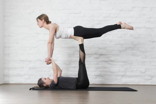 Two Young Women Practicing Acro Yoga Studio Wellbeing Self Care — Zdjęcie stockowe