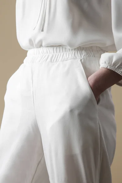 Female model wearing linen outfit. Natural organic linen clothing. Studio shot.