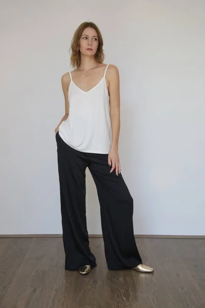 Female Model Wearing White Camisole Cotton Top Black Trousers Classic — 스톡 사진