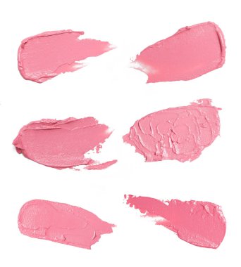 Beyaz arka planda pembe makyaj örnekleri var. Dekoratif kozmetik leke.