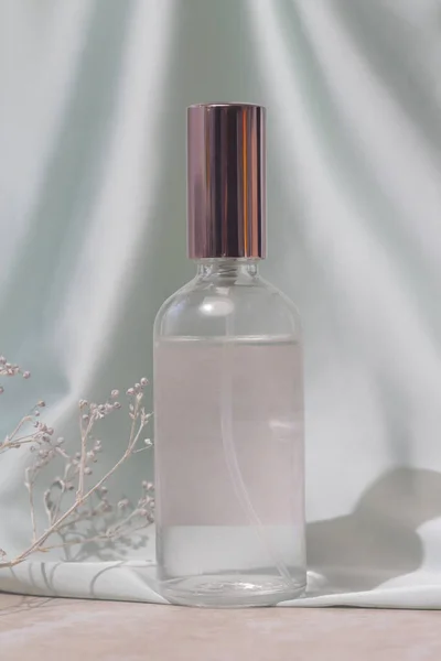 Glass Translucent Spray Bottle Soft Folded Silk Background Luxury Cosmetic — Stock fotografie