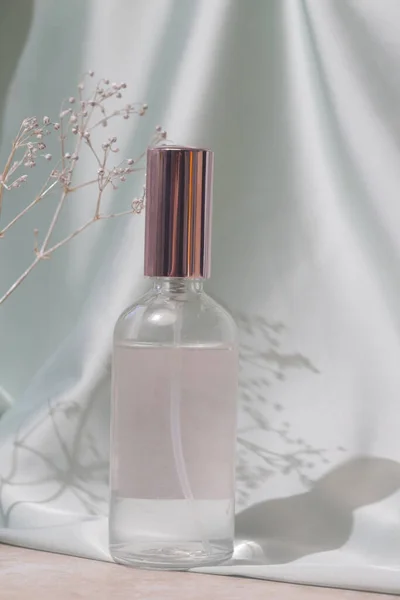 Glass Translucent Spray Bottle Soft Folded Silk Background Luxury Cosmetic — ストック写真