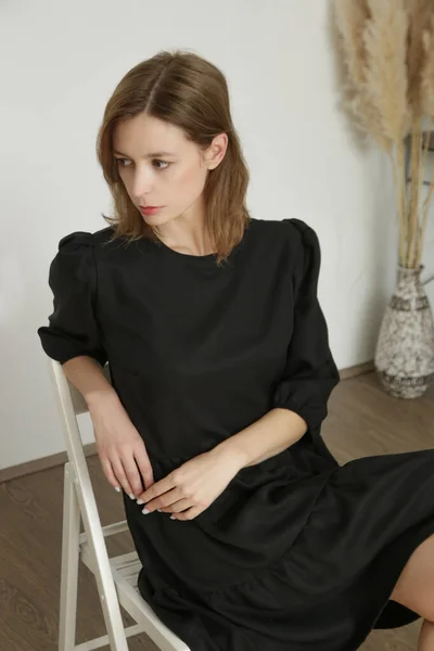 Studio Portrait Young Woman Black Dress Sitting Chair —  Fotos de Stock