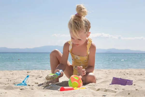 Cute Happy Years Old Girl Playing Plastic Toys Sandy Beach — стоковое фото