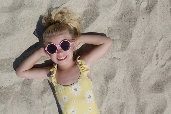 Happy Little Girl Laying Sand Top View — Foto de Stock