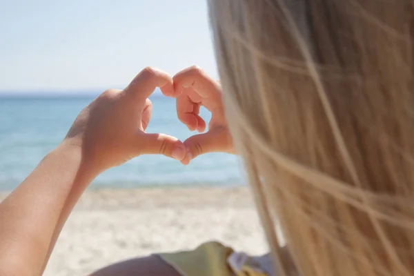 Little Girl Showing Heart Shape Symbol Her Hands Sea — 스톡 사진