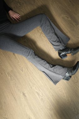 Serie of studio photos of young female model wearing stretch viscose turtleneck and basic flared trousers.