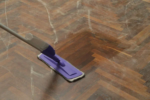 Woman Mopping Very Dusty Wooden Floor — Stockfoto