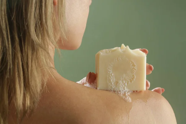 Young Caucasian Woman Holding Soap Bar Her Shoulder Natural Handmade — Stockfoto