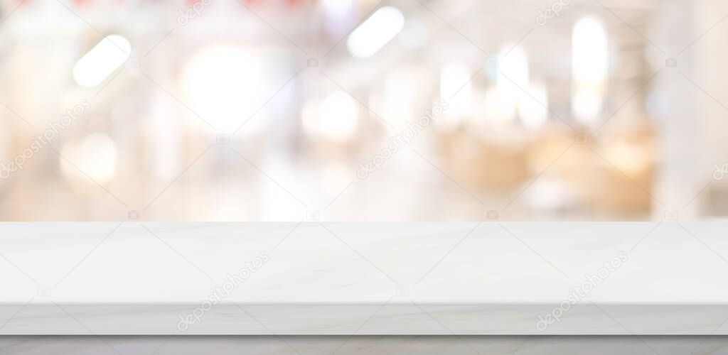 Empty white table top, counter, desk over blur perspective store with bokeh light background, White marble stone table, shelf and blurred shop for food, product display mockup, template backdrop, banner, Retail business wallpaper, poster