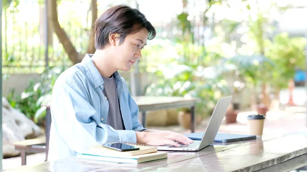 Study online class, Man hand typing on laptop computer while learning online course, Education and technology, Work from home