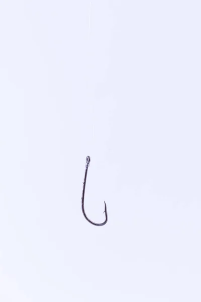 Black Fishing Hook Hanging on a Fishing Line — Stock Photo, Image