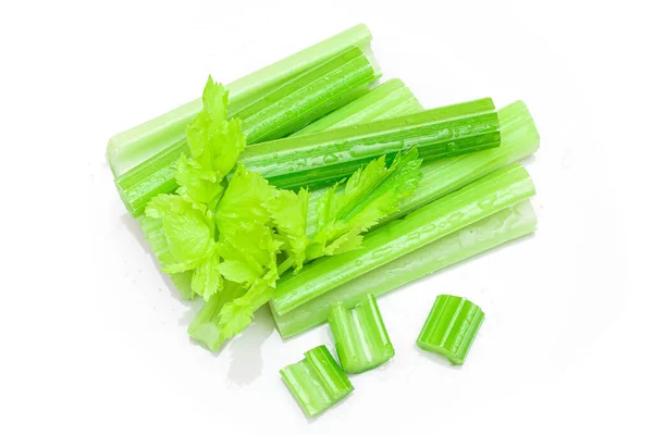 Celery Sticks and Slices with Leaves and Water Drops Terisolasi di Latar Belakang Putih — Stok Foto