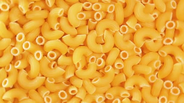 Uncooked Chifferi Rigati Pasta, Scattered Dry Macaroni - Rotating Background — Stock Video