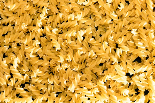 Uncooked Fusilli Pasta - Texture Background — Stock Photo, Image