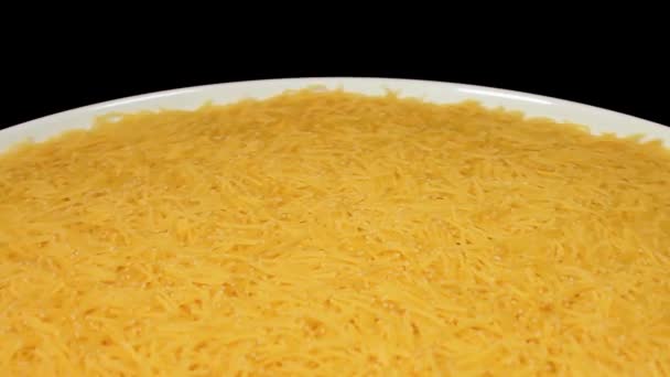 Raw Uncooked Noodles White Plate Rotating Black Background Dry Vermicelli — Stockvideo