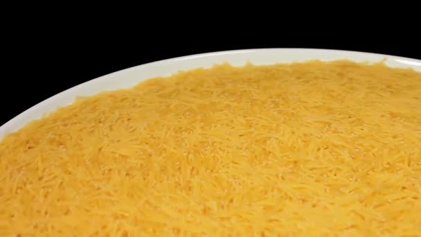 Raw Uncooked Noodles White Plate Rotating Black Background Dry Vermicelli — ストック動画