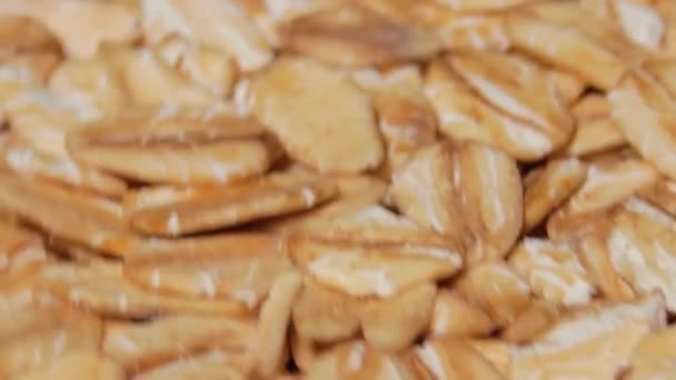 Uncooked Oat Flakes Rotating Macro Scattered Dry Raw Oat Flakes — Vídeo de Stock