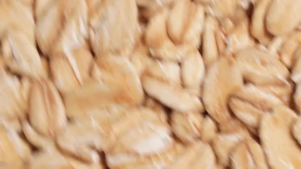 Oat Flakes Background Rotating Counter Clockwise Top View Close Scattered — Vídeo de Stock
