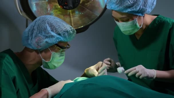 Low Angle Shot Professional Surgeons Team Performing Surgery Operating Room — Stock Video