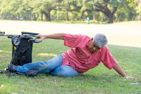 Asian Senior Man Falling Wheelchair Lying Floor Trying Push Wheelchair —  Fotos de Stock