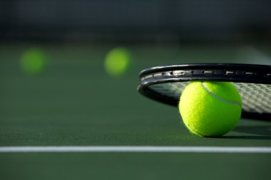 Tennis Balls and a Racket clipart