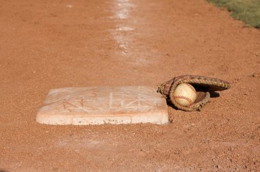 Baseball in a Glove neard a base clipart