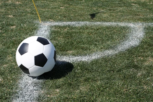 Bola de futebol no canto — Fotografia de Stock