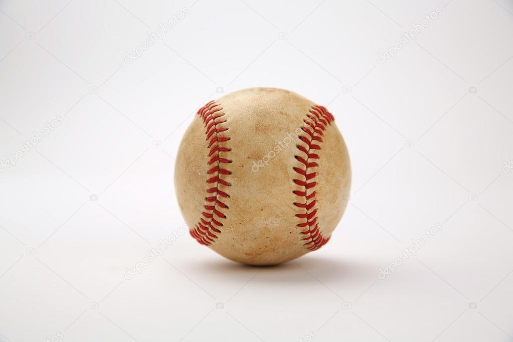 Closeup view of dirty baseball with no logos on white background