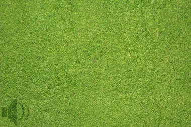 yeşil çim dokusu ve arka plan üzerinde hoparlör simgesi