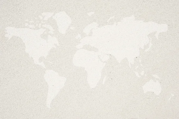 World map icon on sand background and textured — Stock Photo, Image