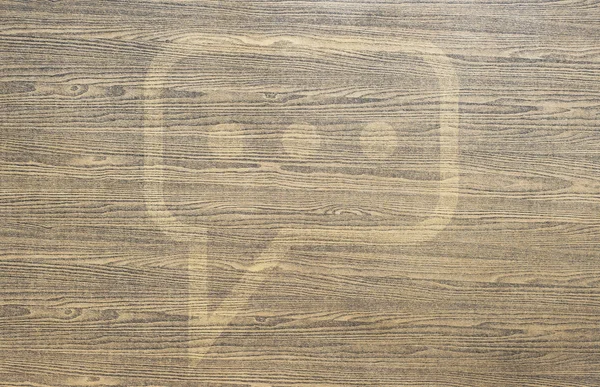 Comment icon on wood background and textured — Stock Photo, Image